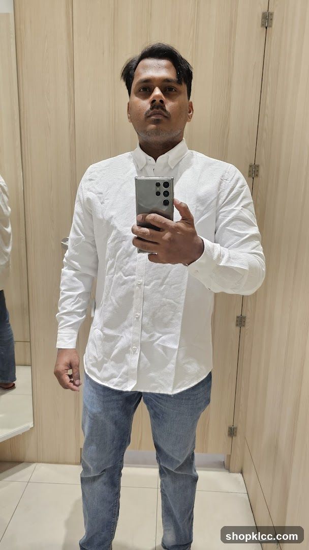 Man in a white shirt and jeans