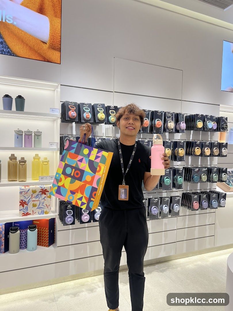 Man holding shopping bag and water bottle in store