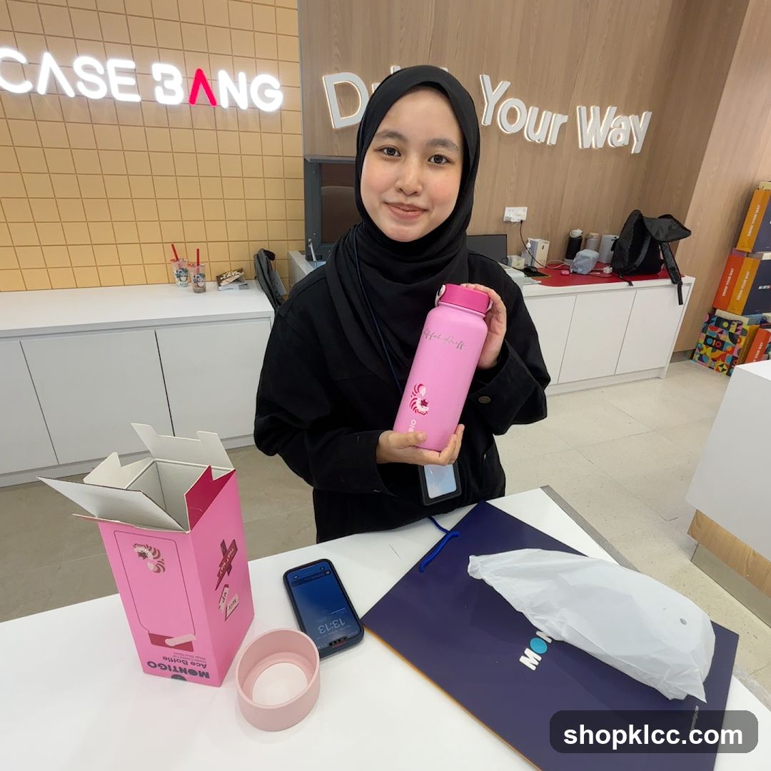 Woman holding a pink water bottle