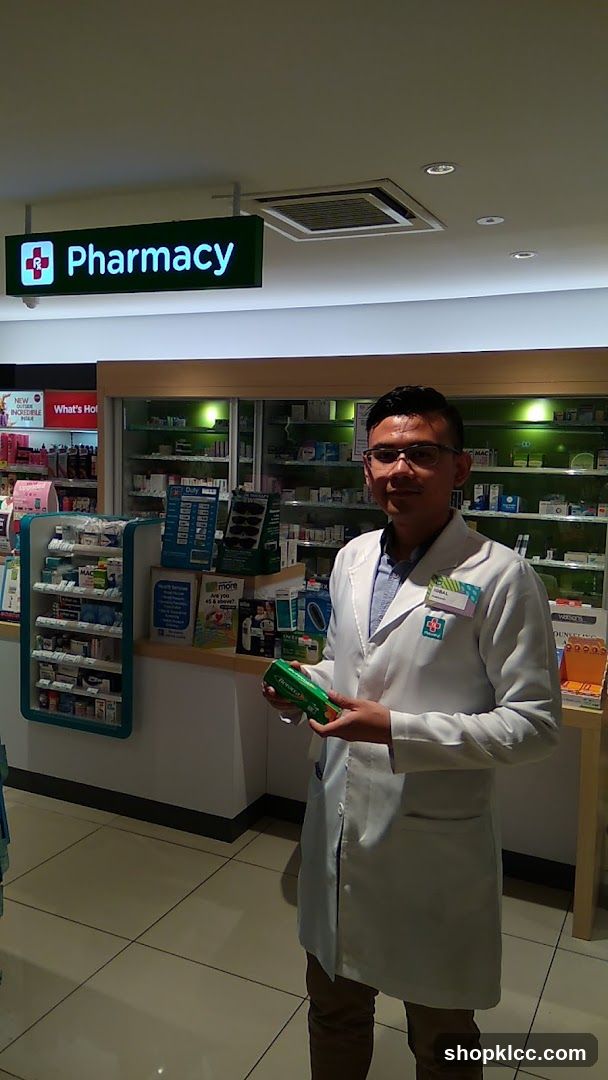 Pharmacist holding a product