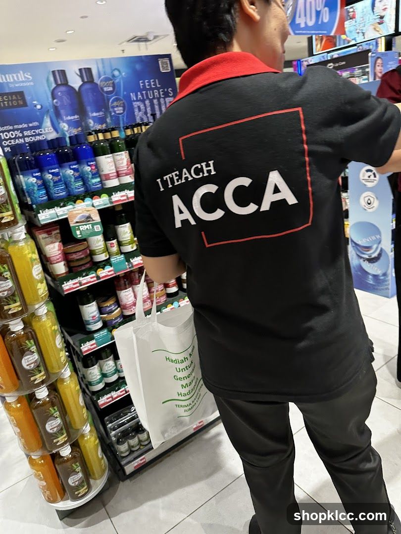Person wearing a t-shirt with "I TEACH ACCA" printed on the back