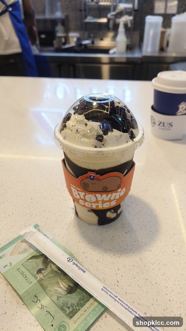 Dessert Drink with Money and Straw