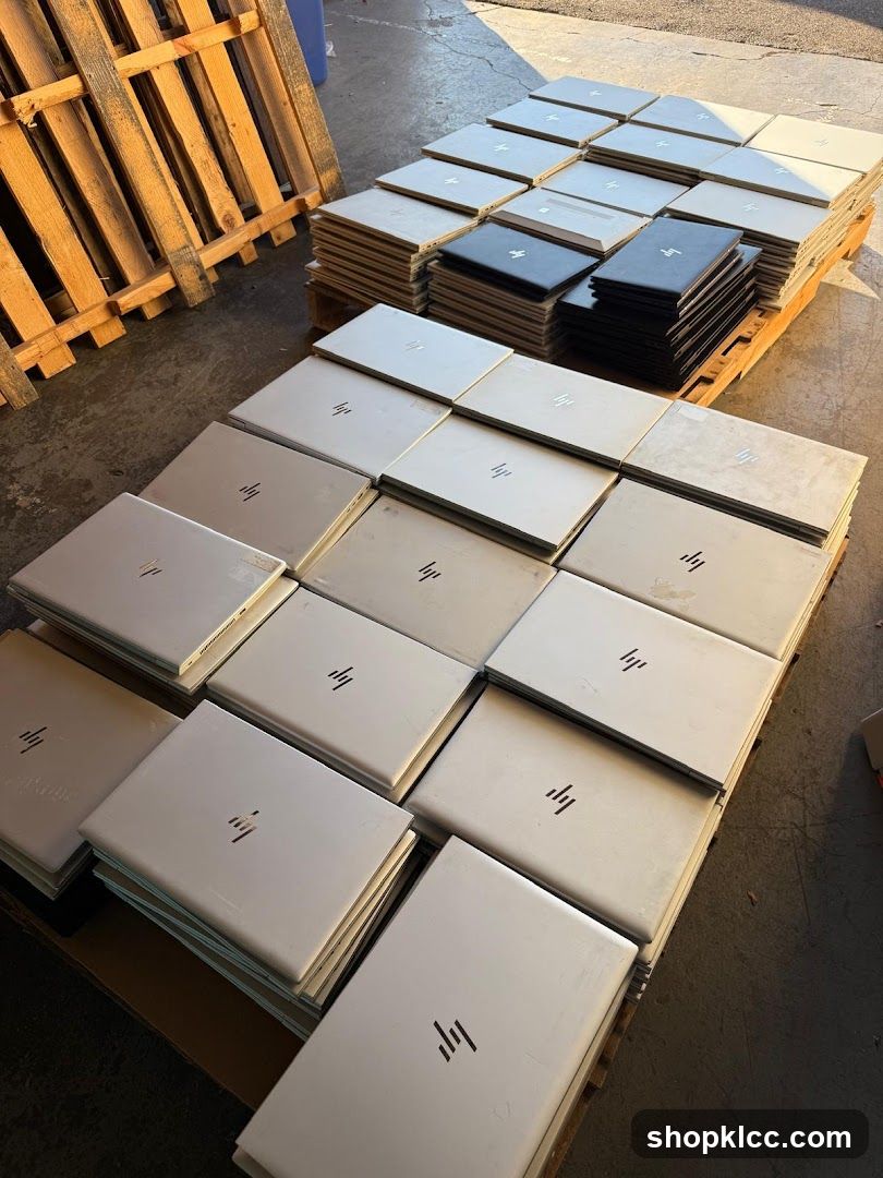 Stack of HP Laptops in Warehouse