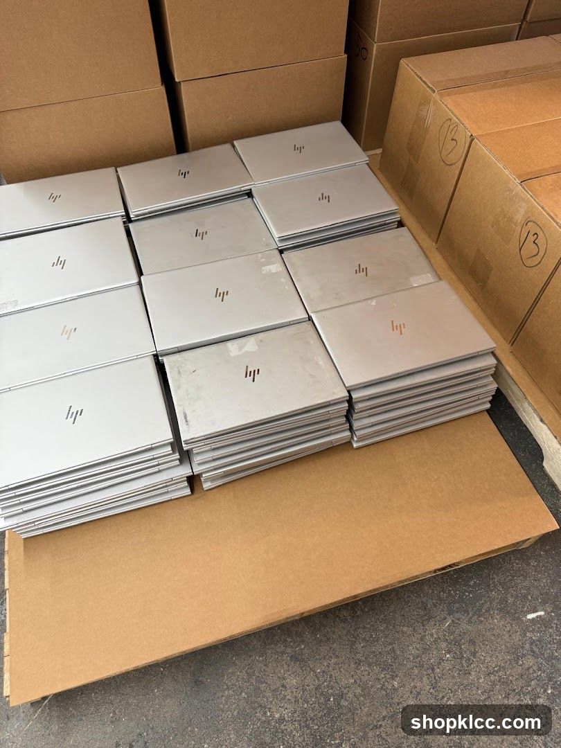 Stack of HP Laptops in Warehouse