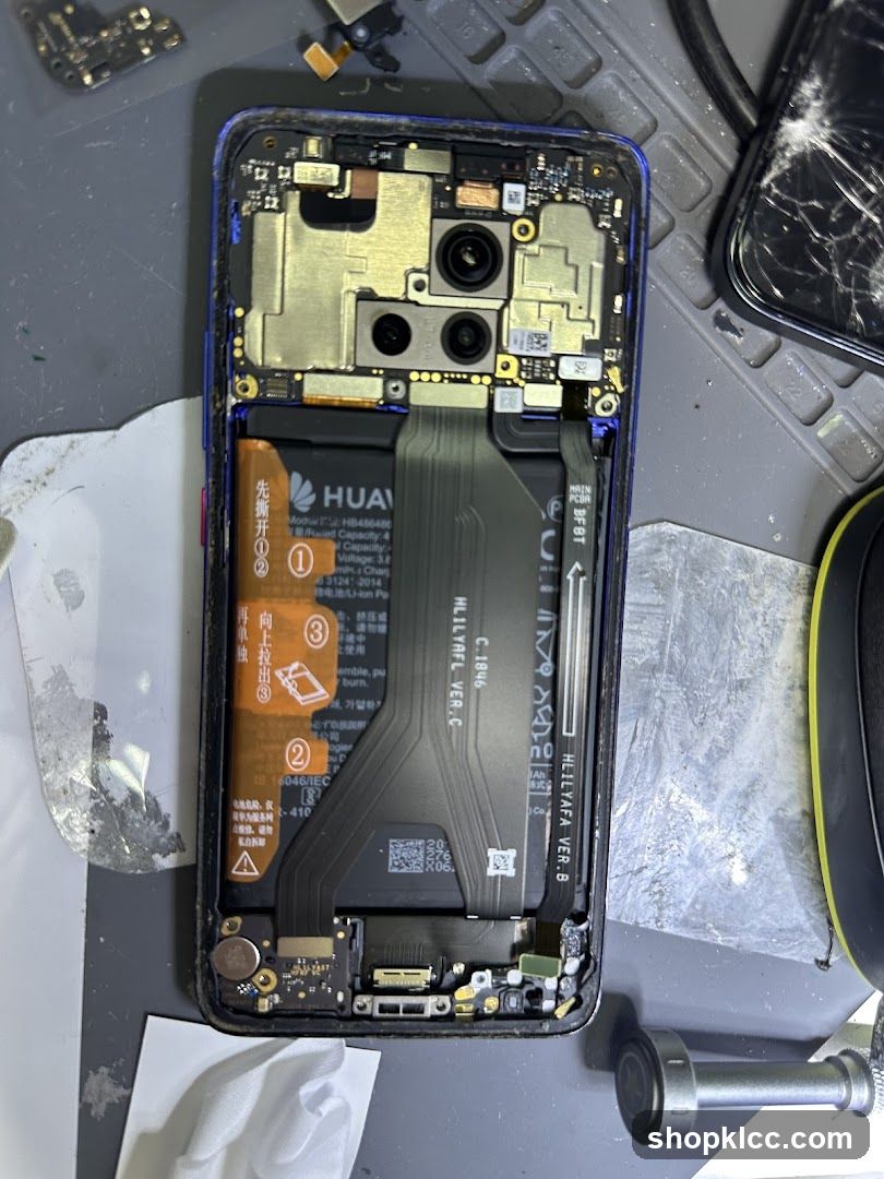 Disassembled Smartphone on Workbench