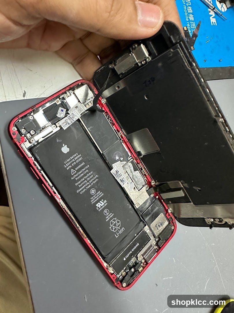 Disassembled iPhone on Workbench