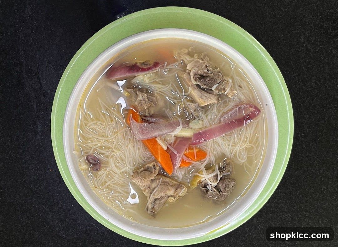Bowl of Noodle Soup with Meat and Vegetables