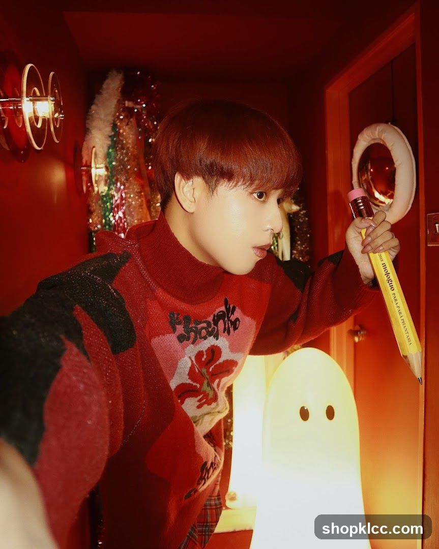 Red-themed interior selfie with pencil prop