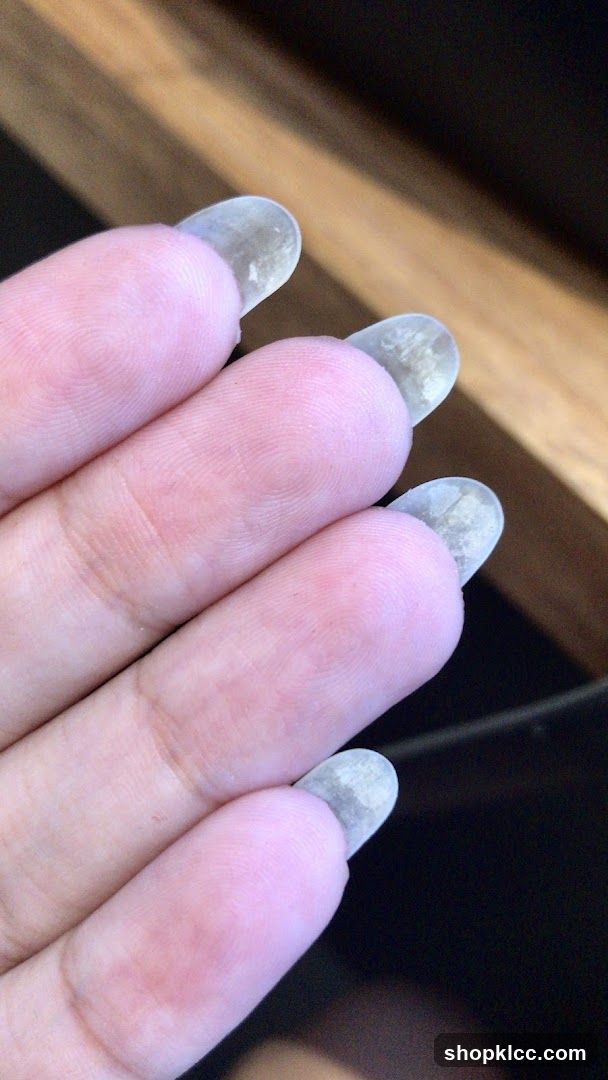 Hand with clear nail tips