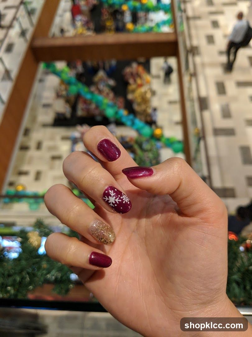 Christmas-themed manicure in a mall