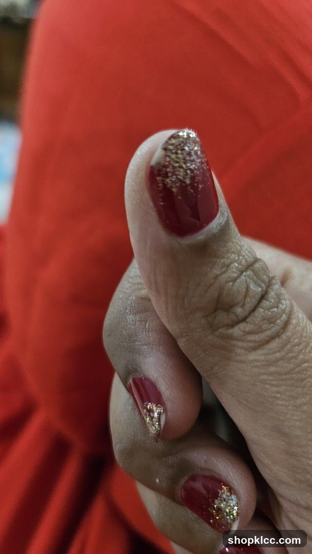 Red Nail Art with Gold Glitter