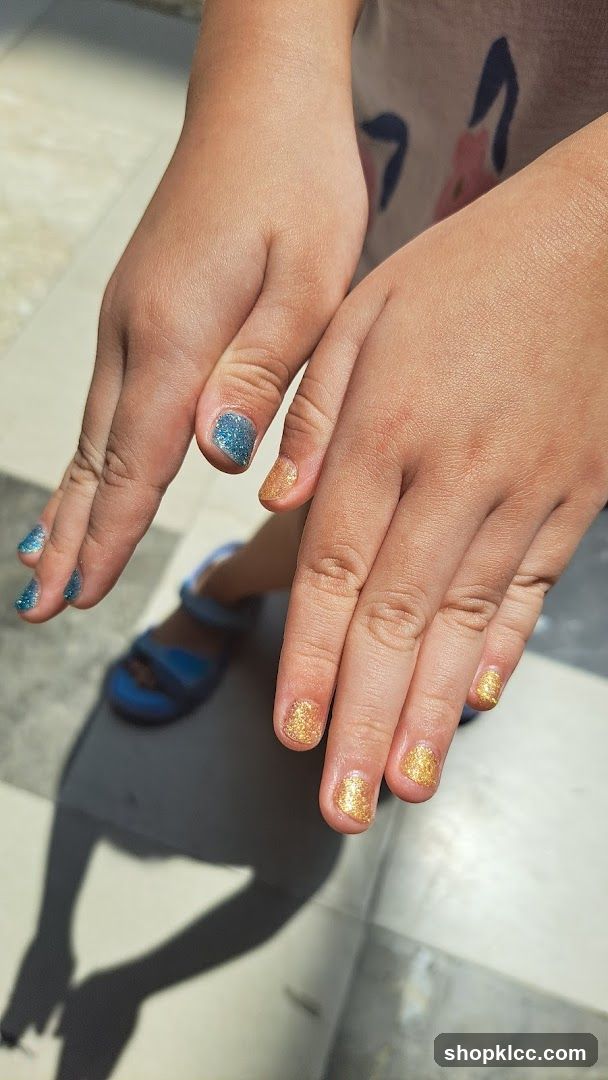 Child's Hands with Glitter Nail Polish