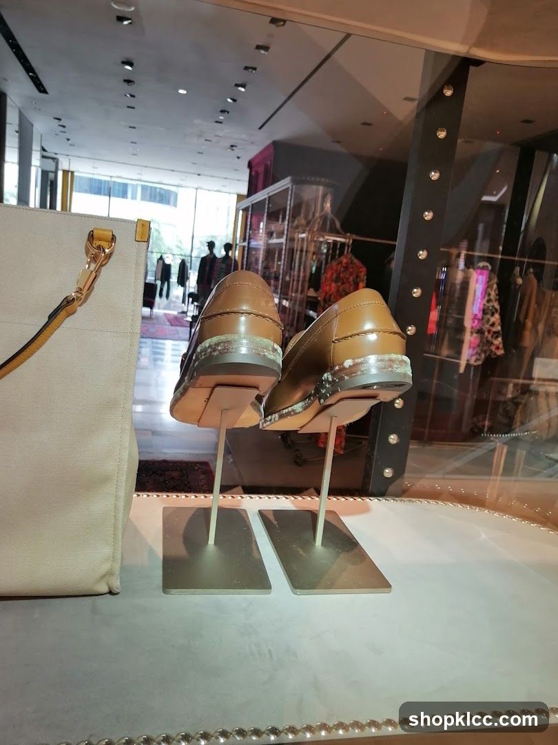 Display of brown leather loafers in a store window