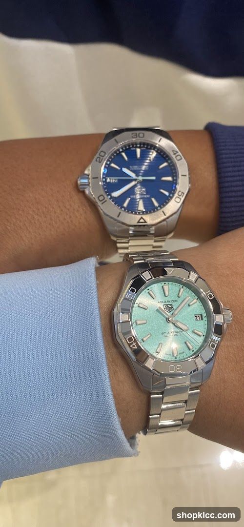Two watches on wrists