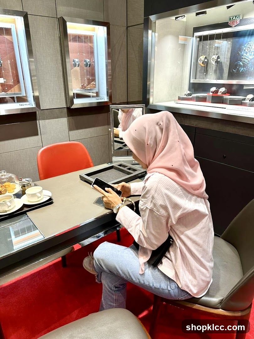 Woman browsing phone in a watch store