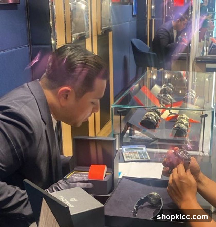 Salesperson showing a watch to a customer
