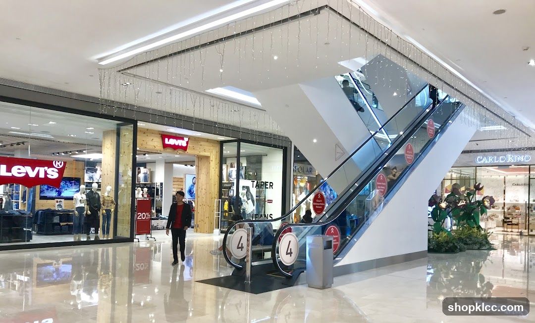 Shopping Mall Interior with Escalator and Stores
