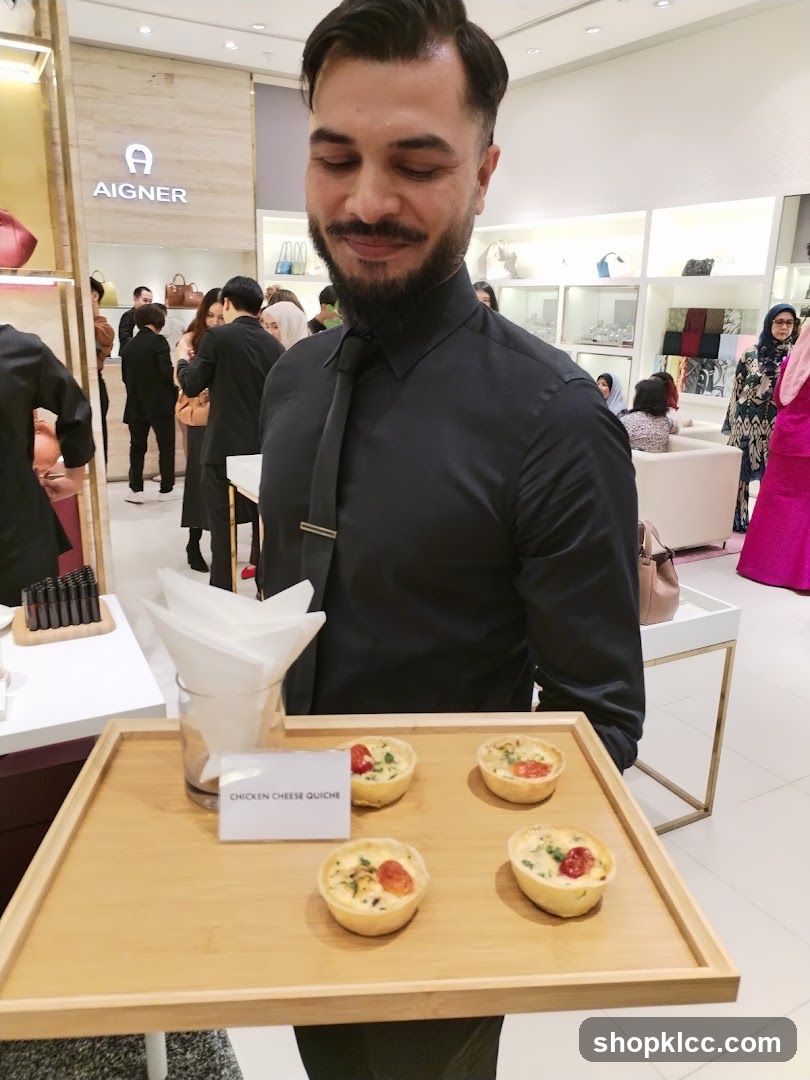 Staff offering quiches at a store event