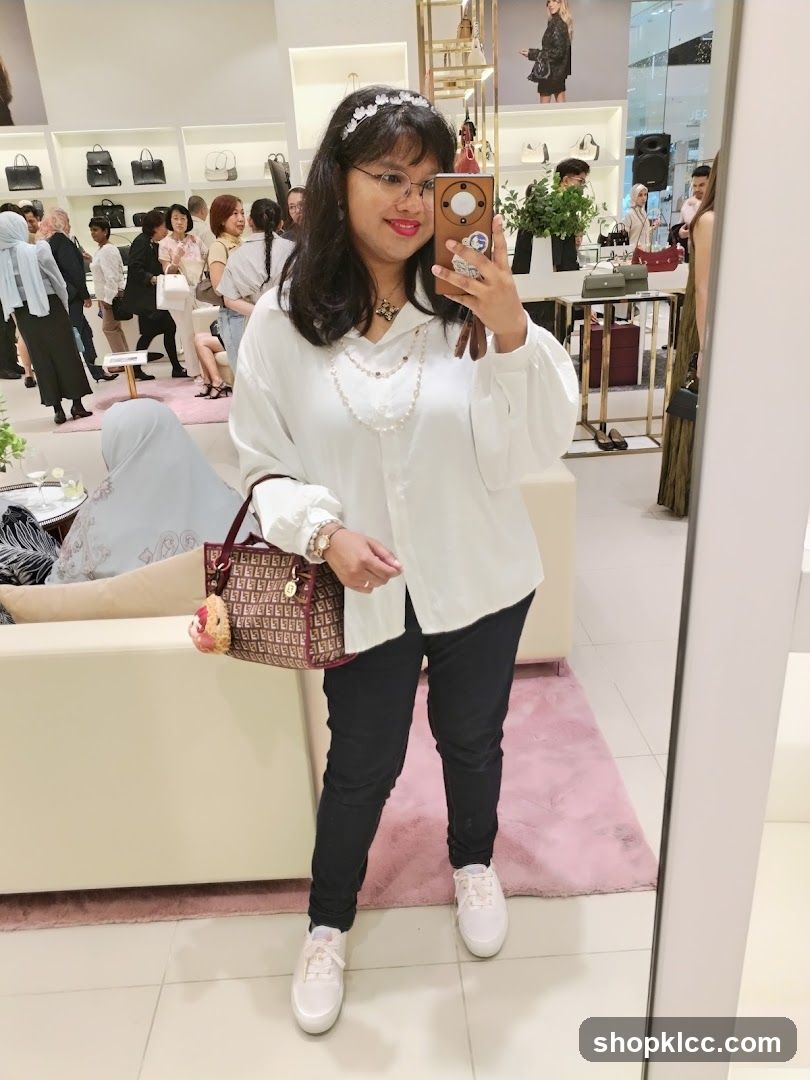 Woman taking a mirror selfie in a boutique