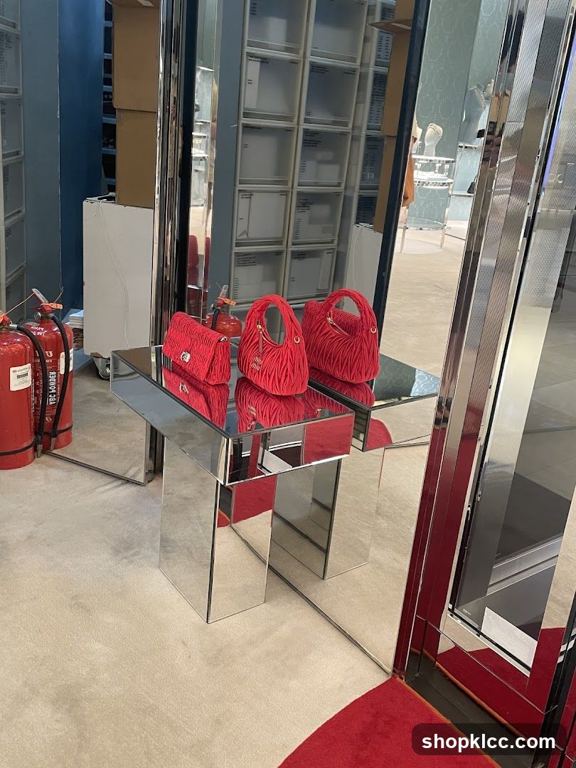 Red Handbags on Mirrored Table