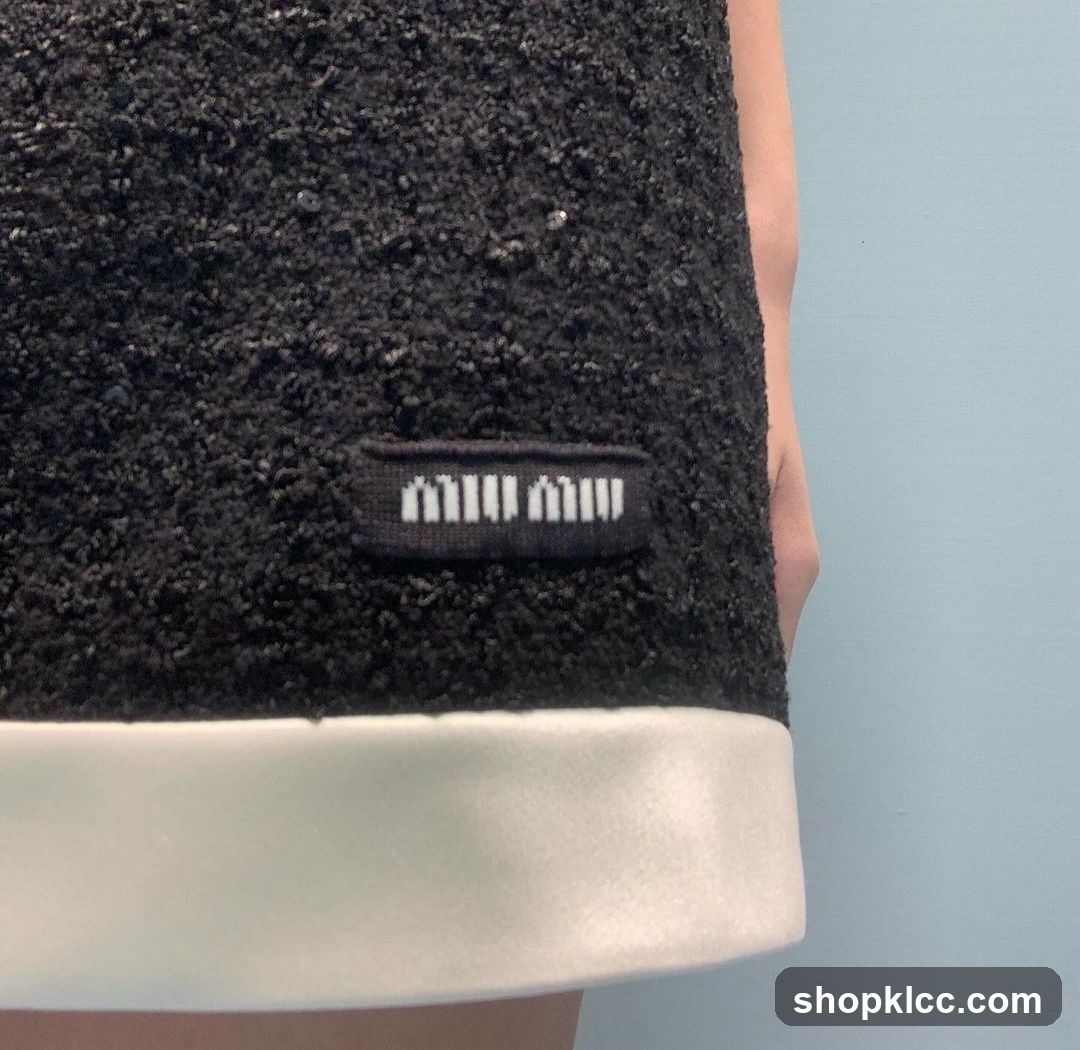 Miu Miu Label on Black Textured Garment