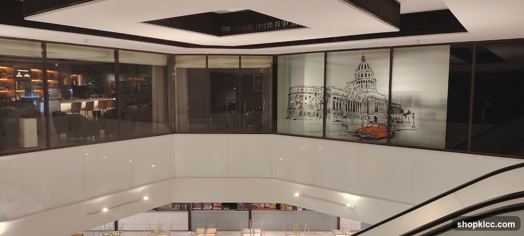 Interior of a building with a bar and a decorative window