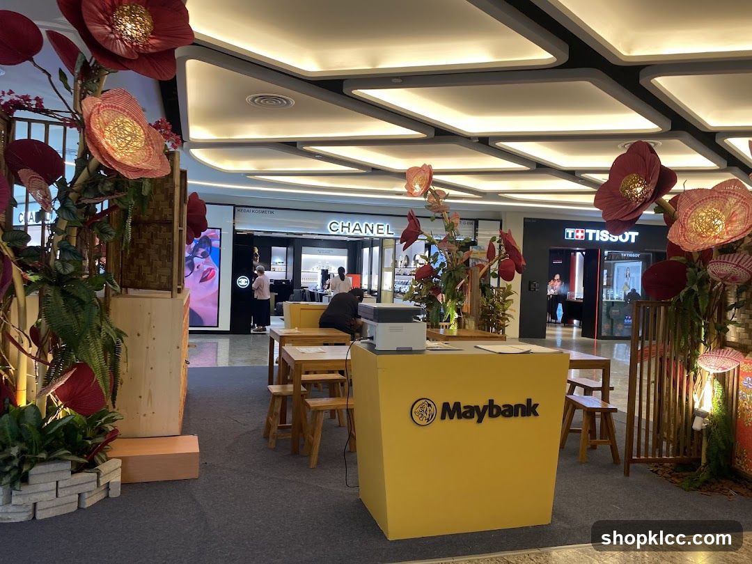 Maybank Booth with Chanel and Tissot Stores in Background