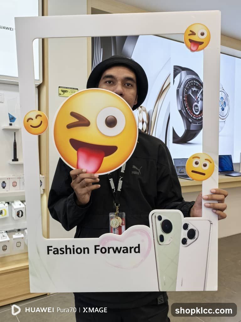 Man Posing with Photo Booth Frame