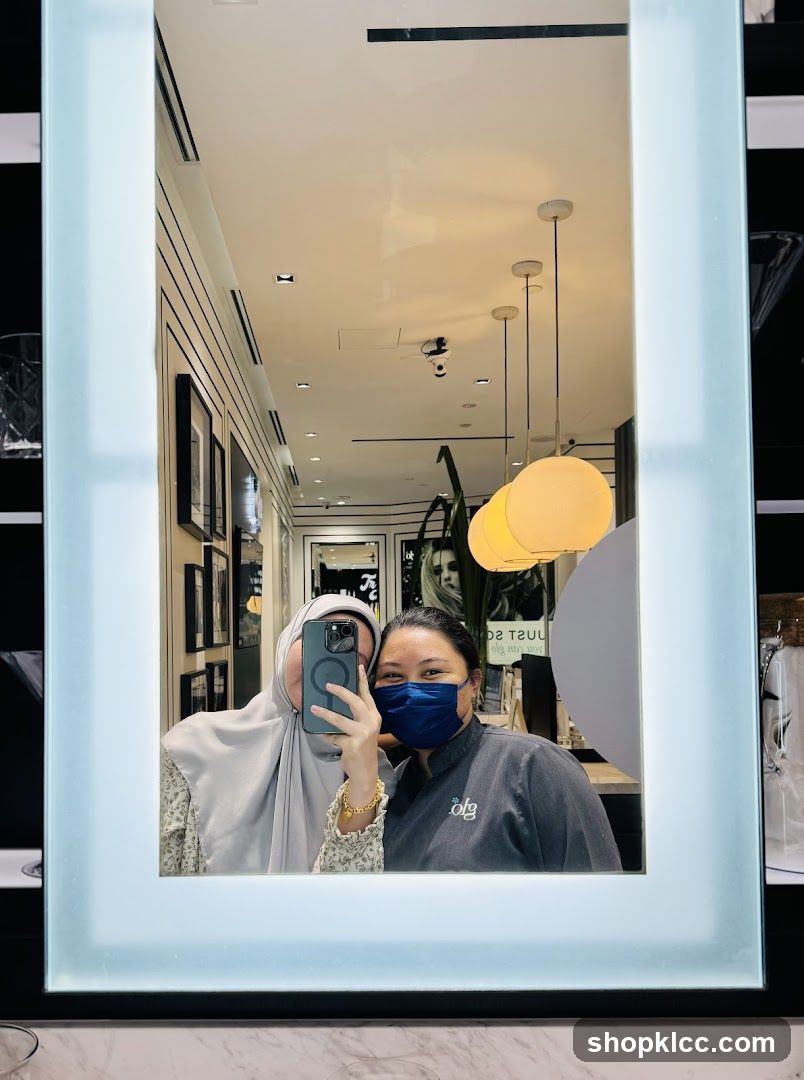 Two Women Taking a Mirror Selfie