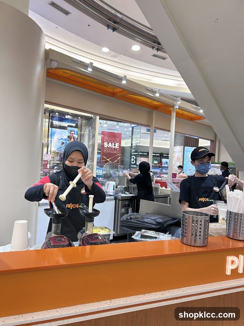 Juice Bar Staff Preparing Drinks