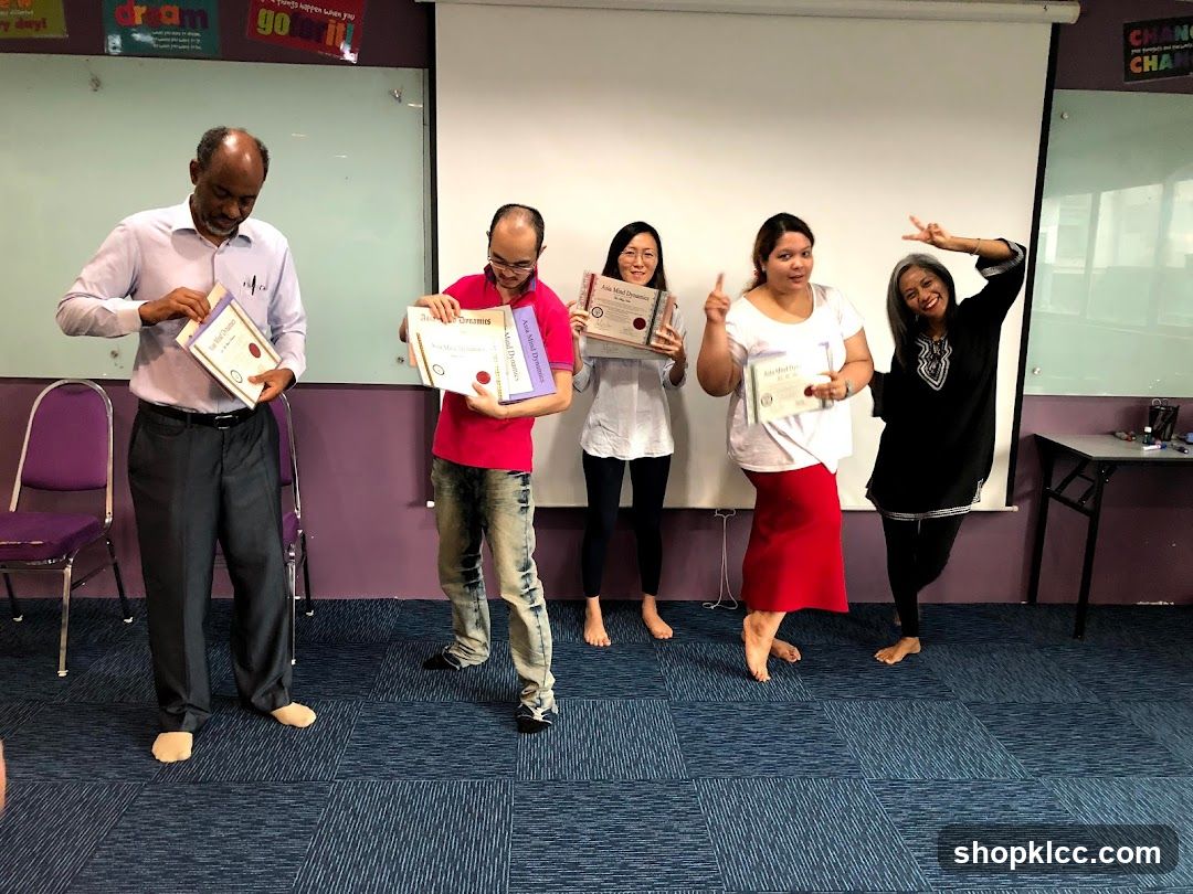 Group holding certificates in classroom