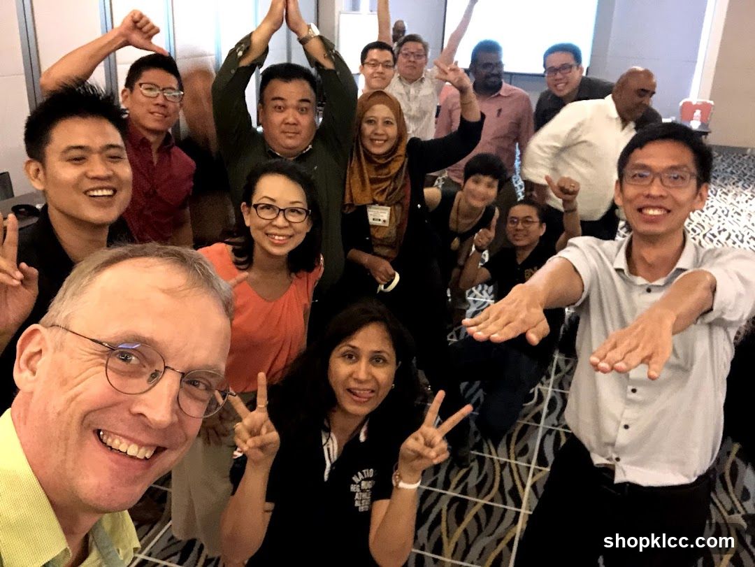 Group selfie with diverse people indoors