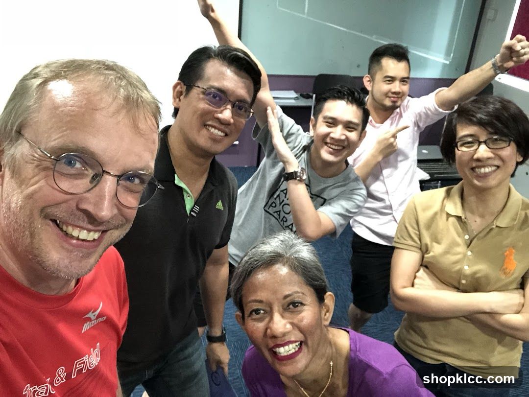 Group selfie in office or studio setting