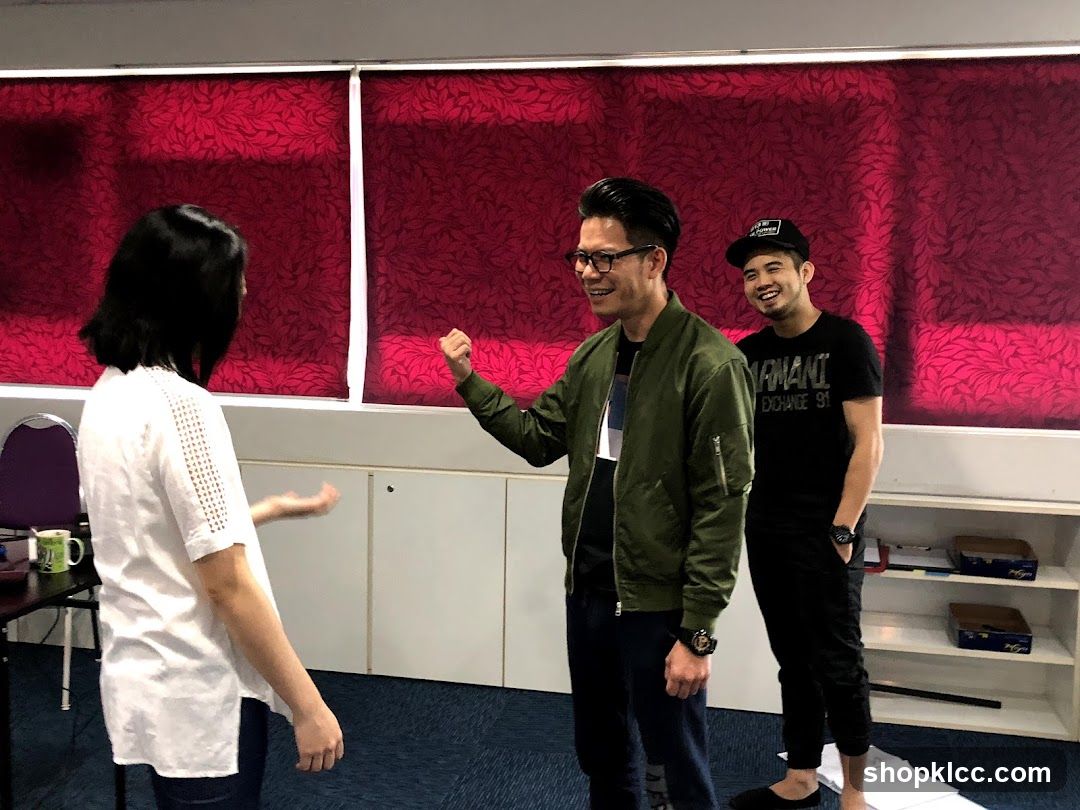 Group in a room with red curtains