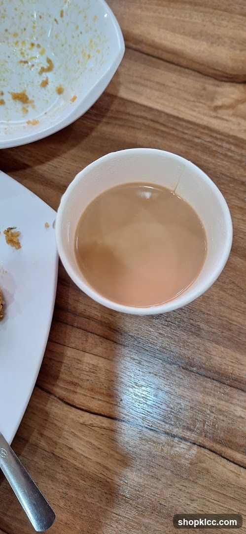 Cup of tea and dirty plate