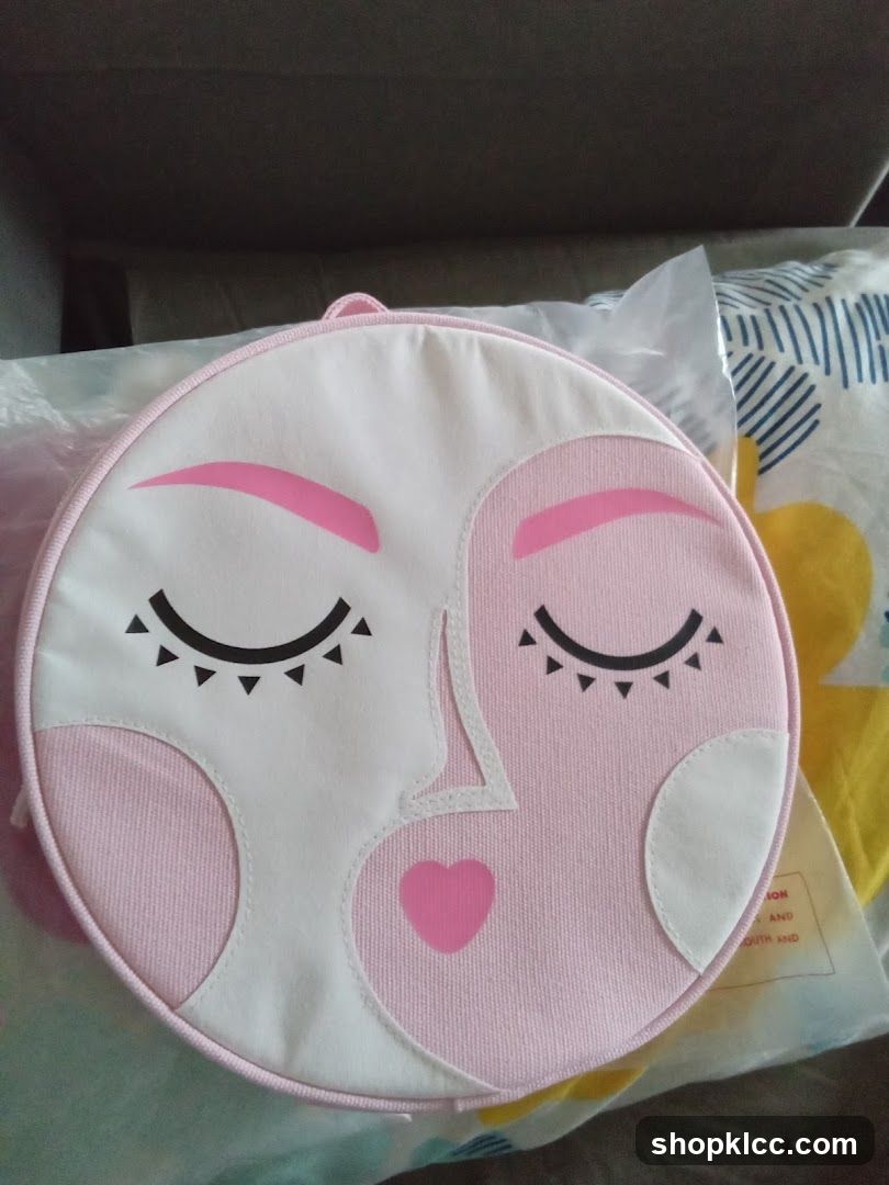 Round Pink Bag with Face Design
