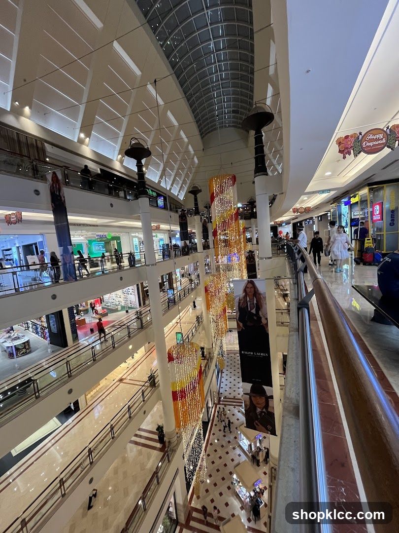Multi-level shopping mall interior with festive decorations