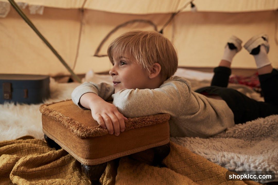 Boy relaxing in a tent
