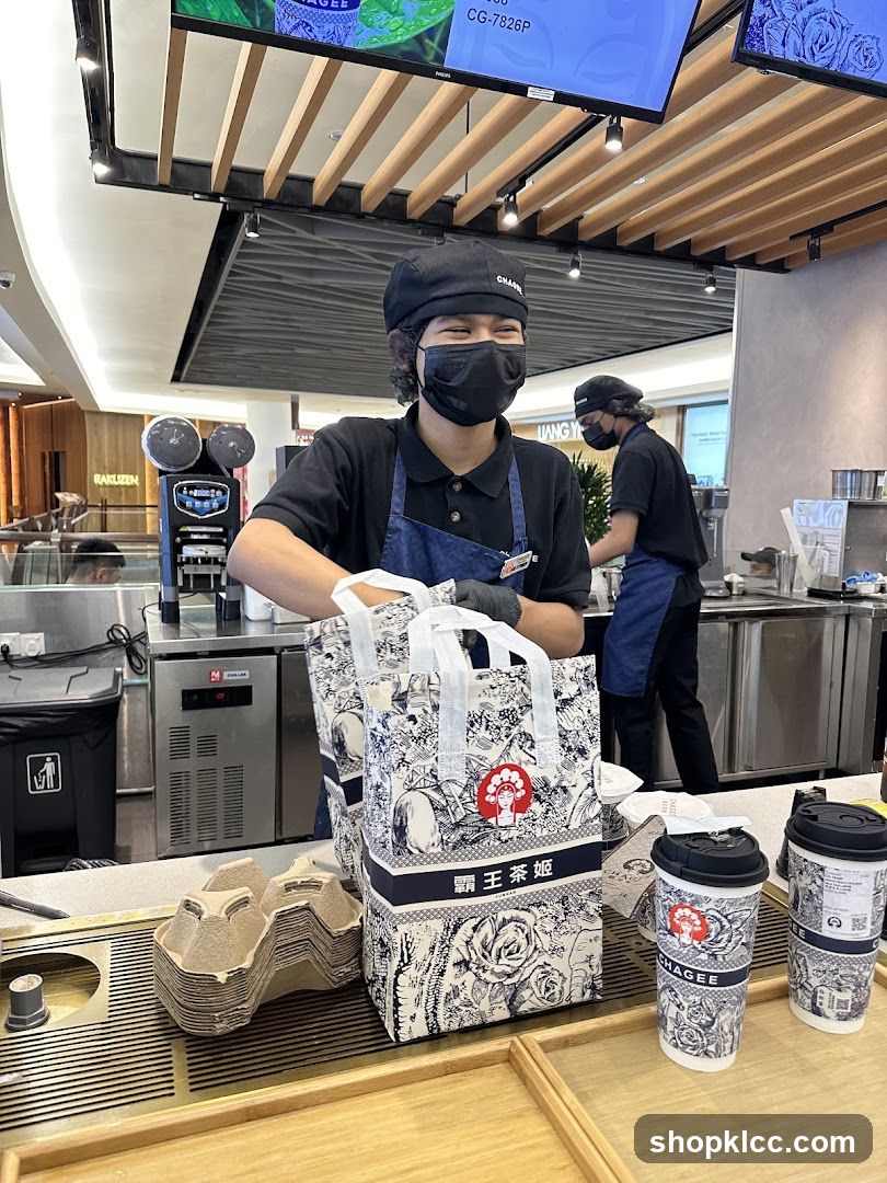 Tea Shop Staff with Merchandise