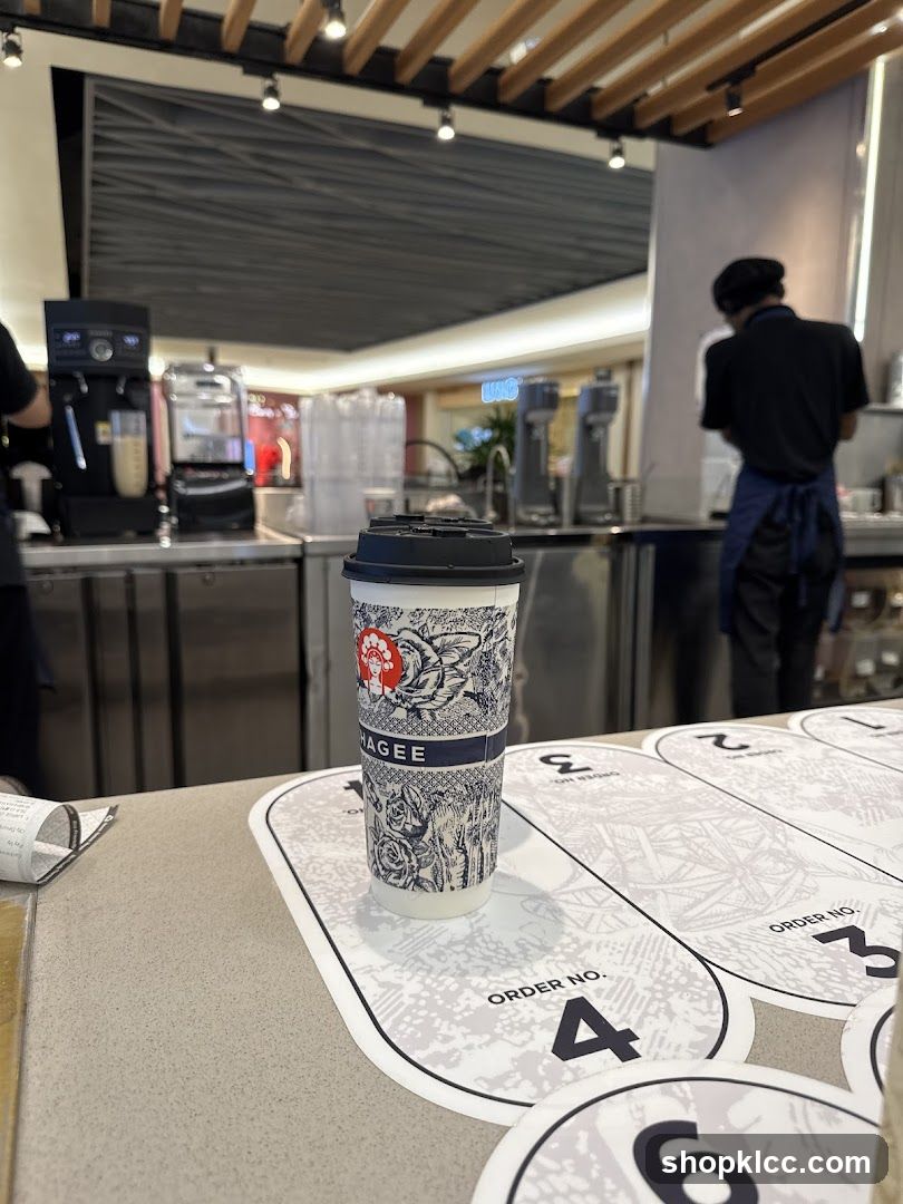 Coffee cup on counter with order numbers
