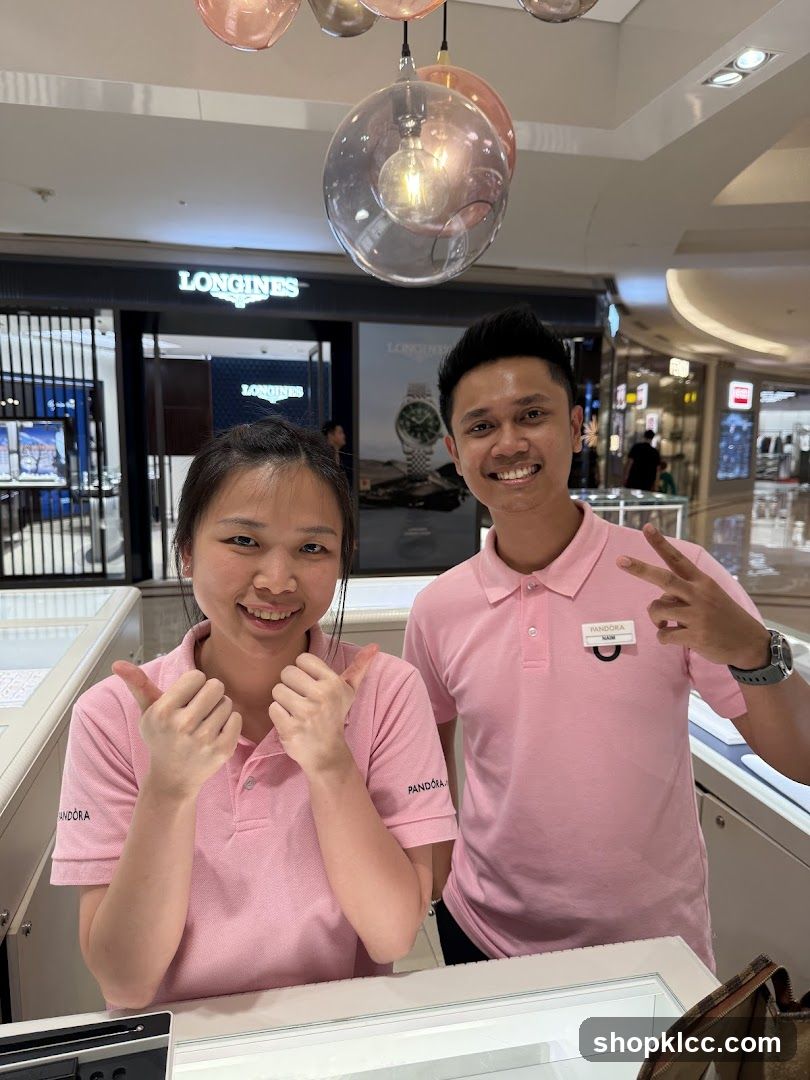 Two employees in pink shirts