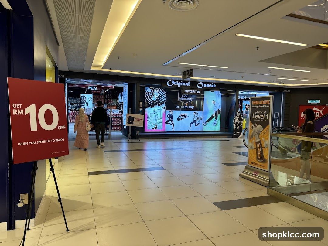 Shopping Mall Interior with Storefronts and Promotional Displays