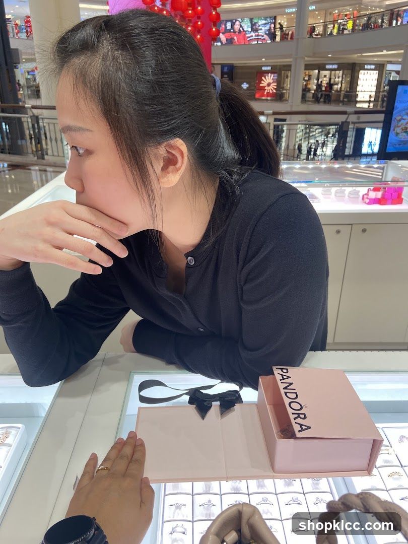 Woman looking at jewelry display