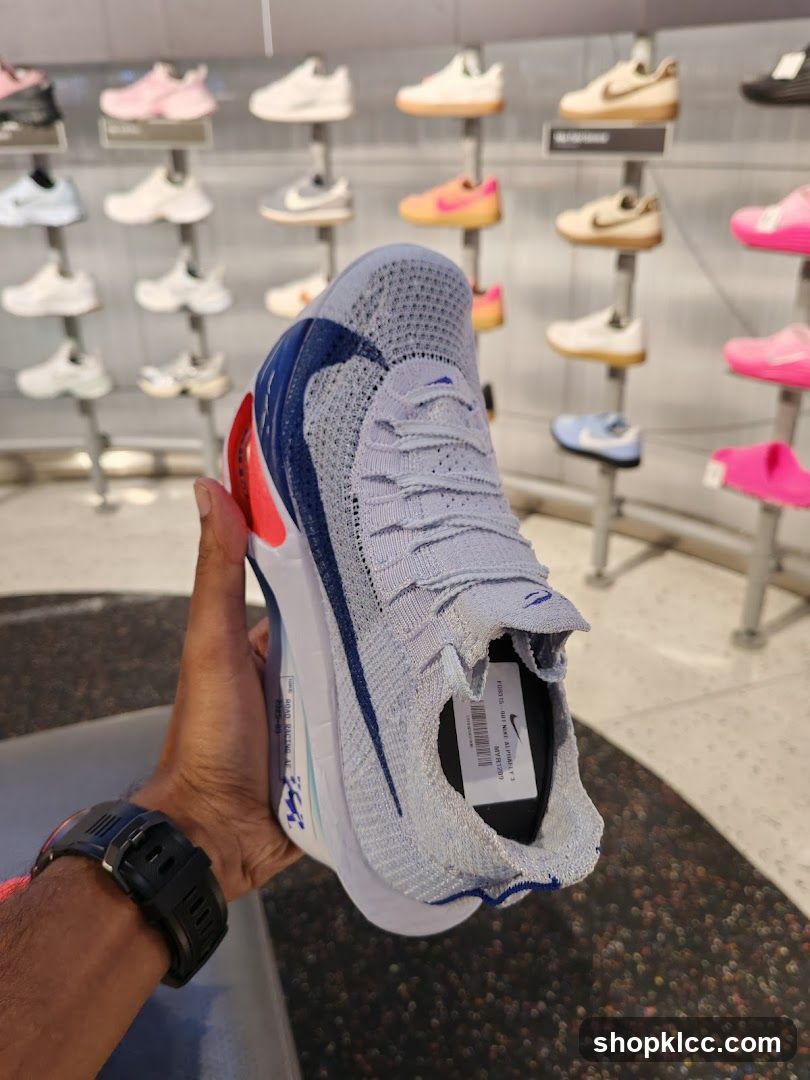 Man holding a Nike shoe