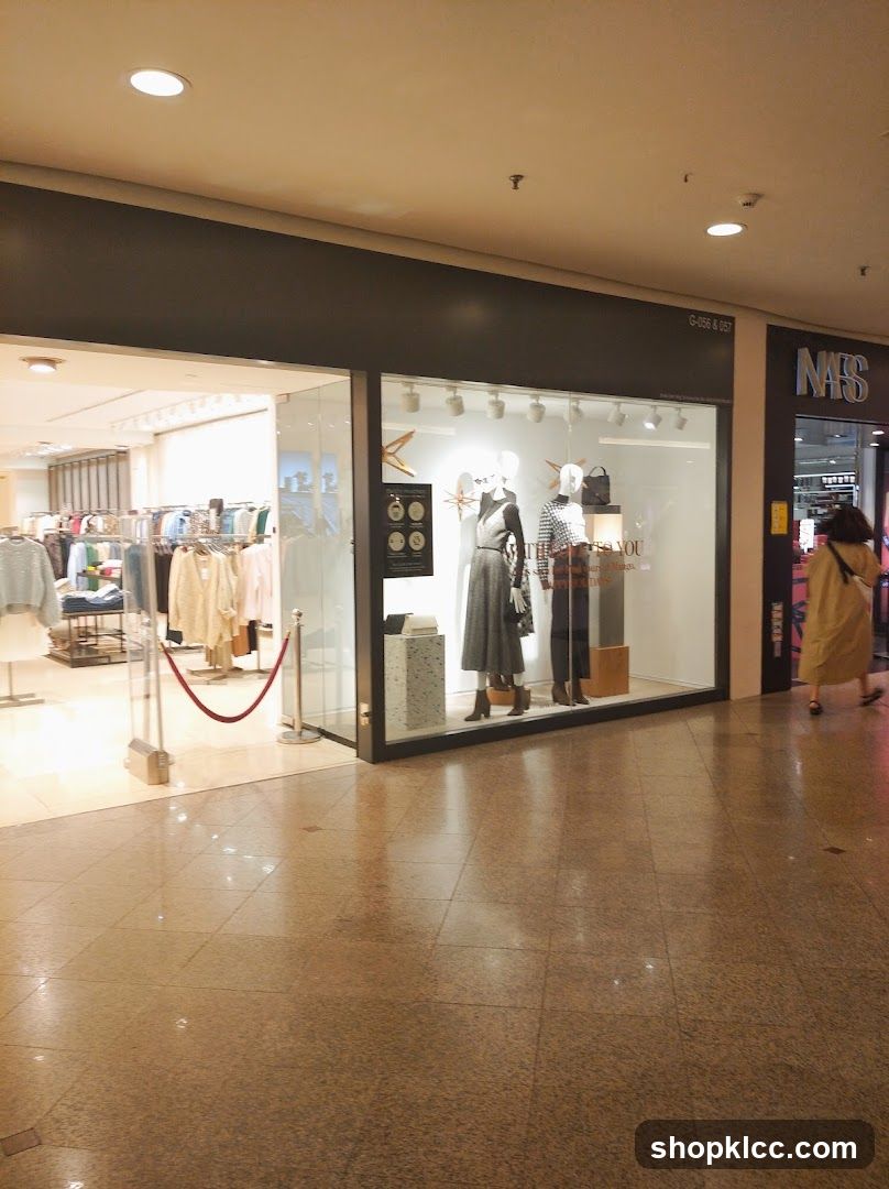 Storefront with Mannequins and Clothing Racks