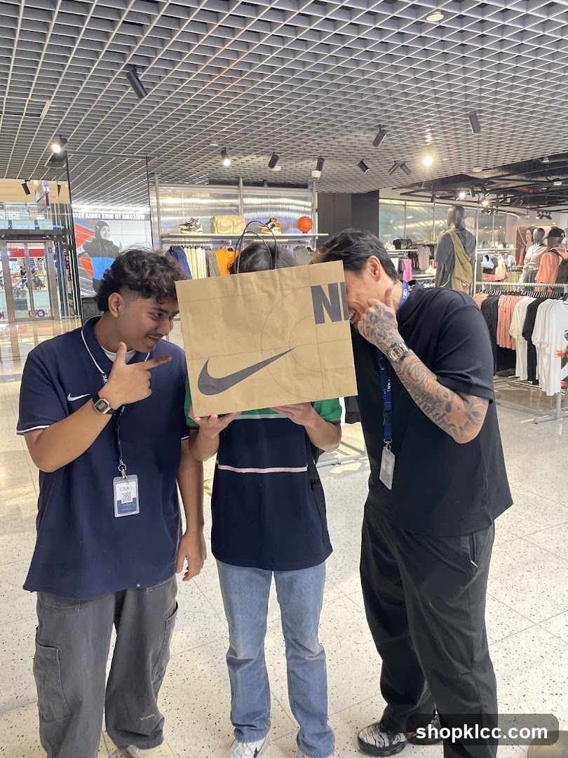 People holding a Nike shopping bag