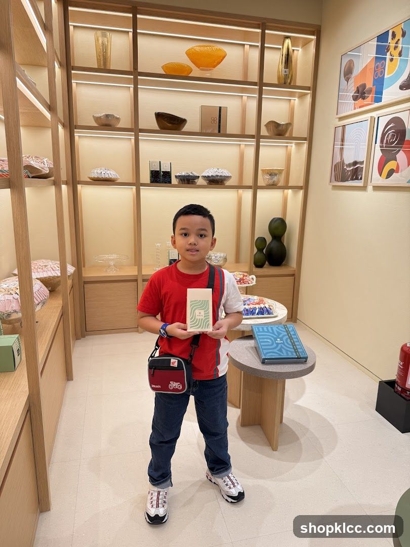 Boy holding a small box in a store