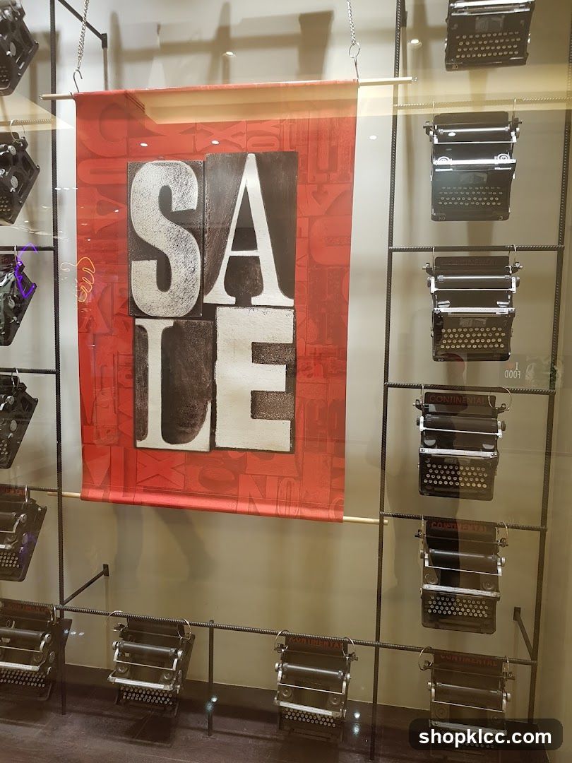 Typewriter Display with Sale Banner