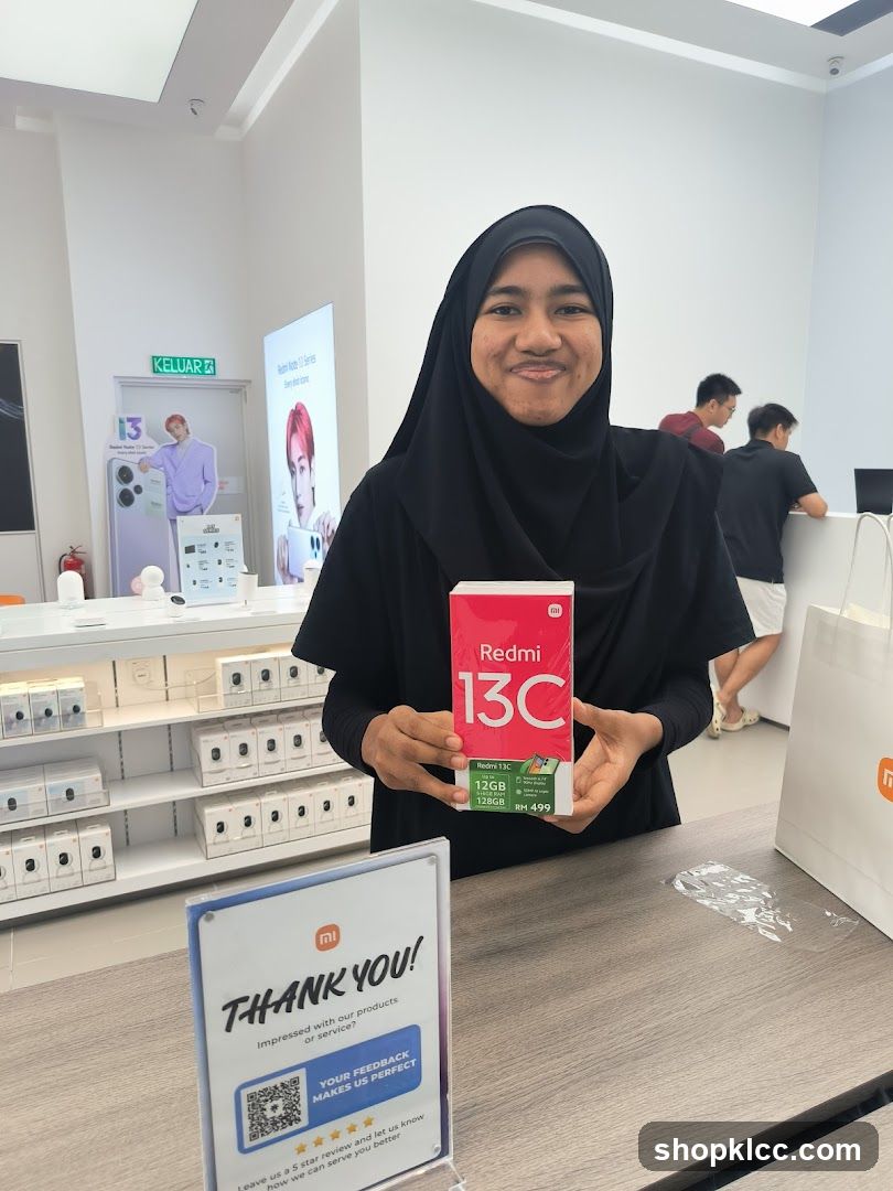 Woman Holding a Redmi 13C Box