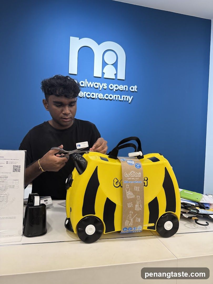 Employee preparing a Trunki suitcase